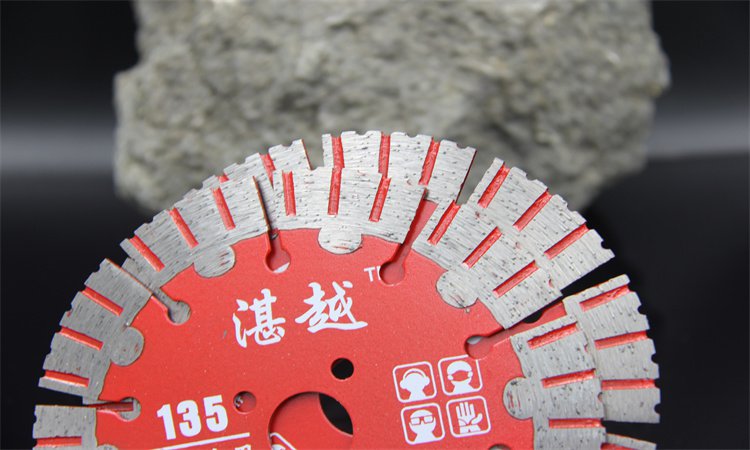 Close-up of a red patterned blade marked 135