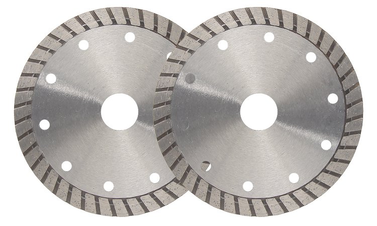 Two silver patterned-rim diamond blades