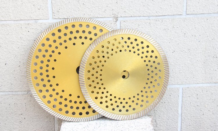 Two gold-coloured perforated diamond discs