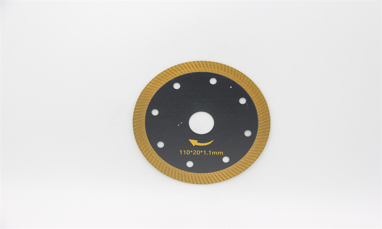 Black-and-gold diamond blade with round holes