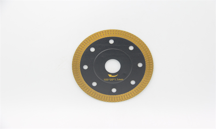 Black-and-gold diamond blade with a raised centre