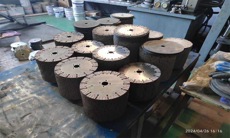 Stacks of circular steel blade cores in a workshop