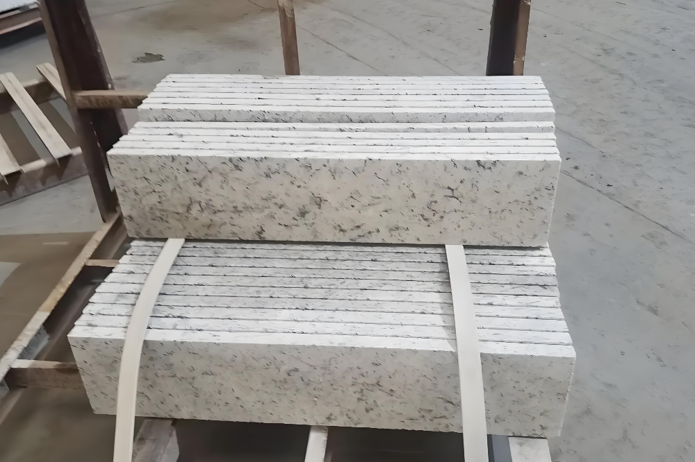 Stacked cut stone slabs on a workshop trolley