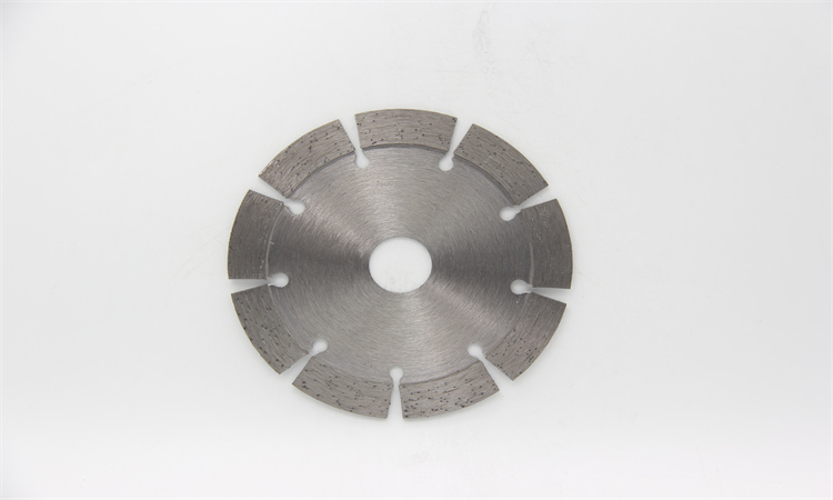 Silver segmented diamond blade on a white background