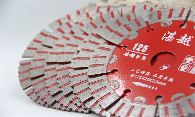 Close-up of red diamond blades with a visible 125 marking